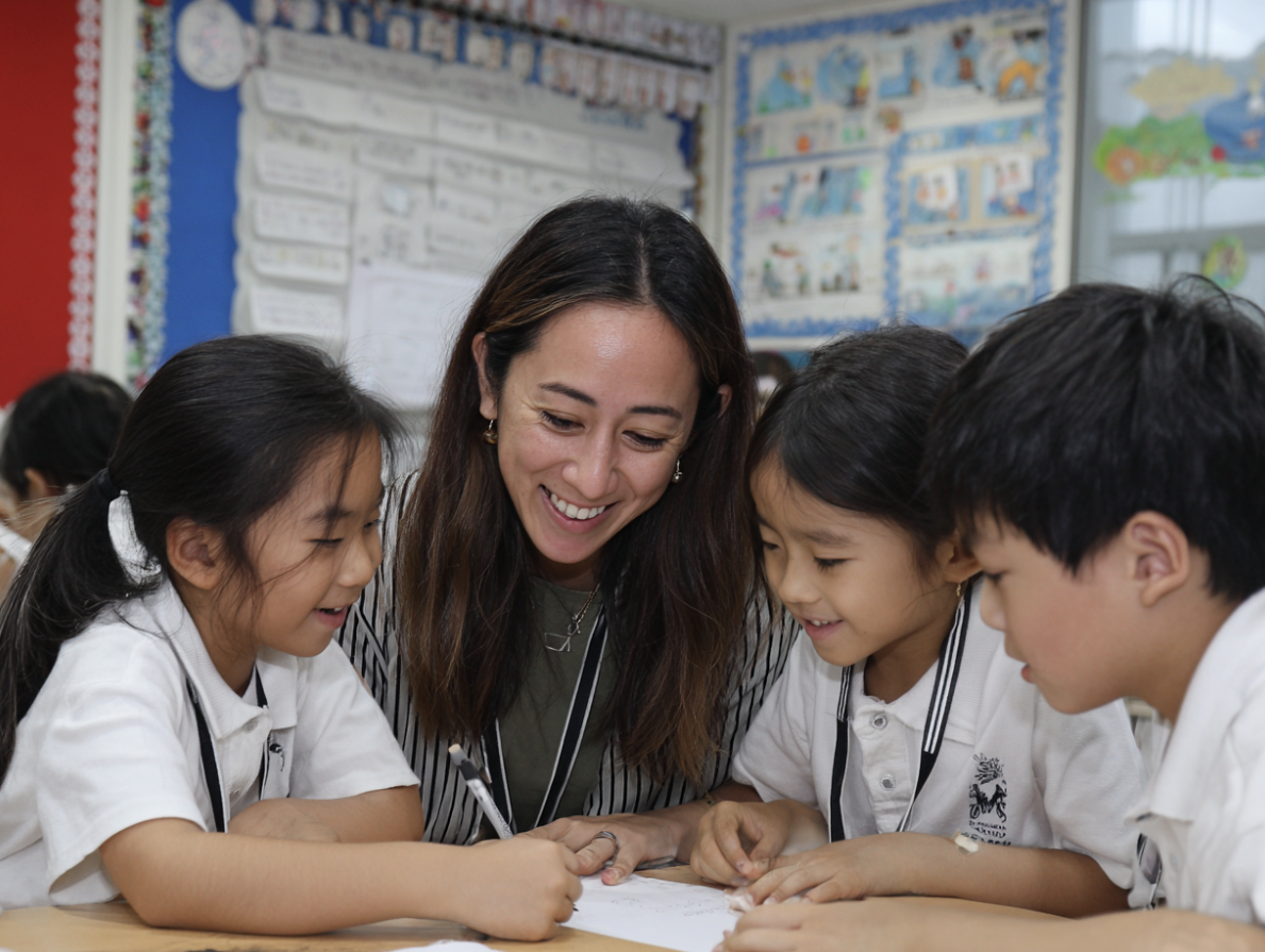 A teacher leading a class discussion during circle time, showcasing emotional literacy in action within a school setting.